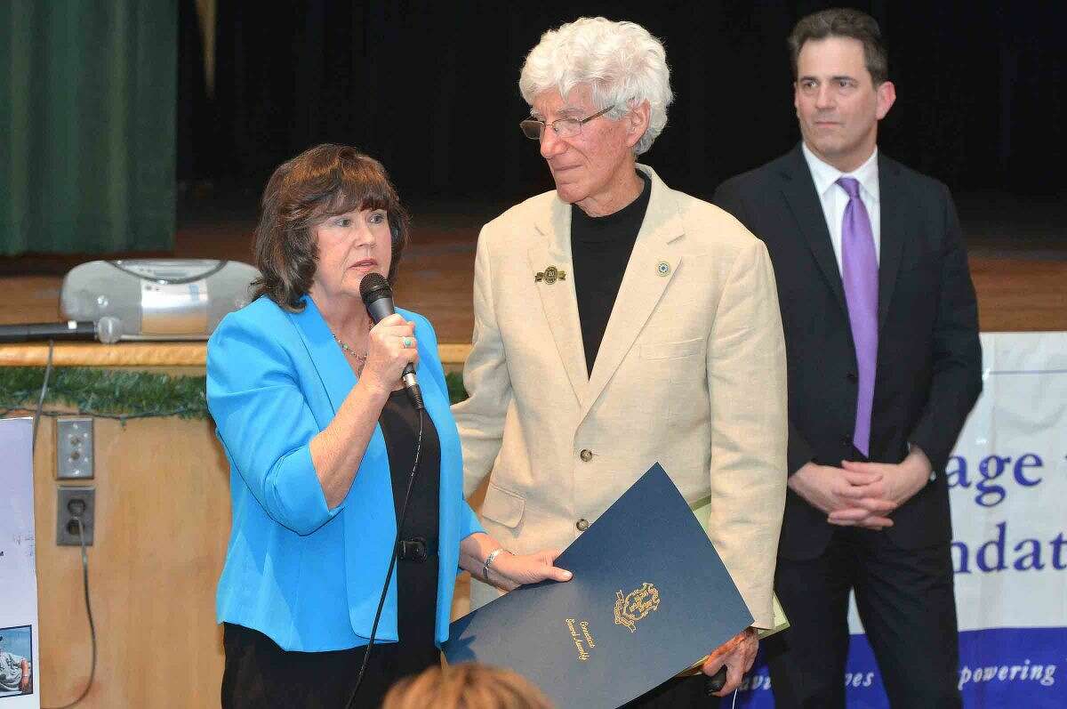 Hour Photo/Alex von Kleydorff Ginger and Larry Katz accept a proclomationfrom The General Assembly and State Rep Chris Perone during the 12th annual Courage to Speak Empowering Youth to be Drug Free family Night at West Rocks School