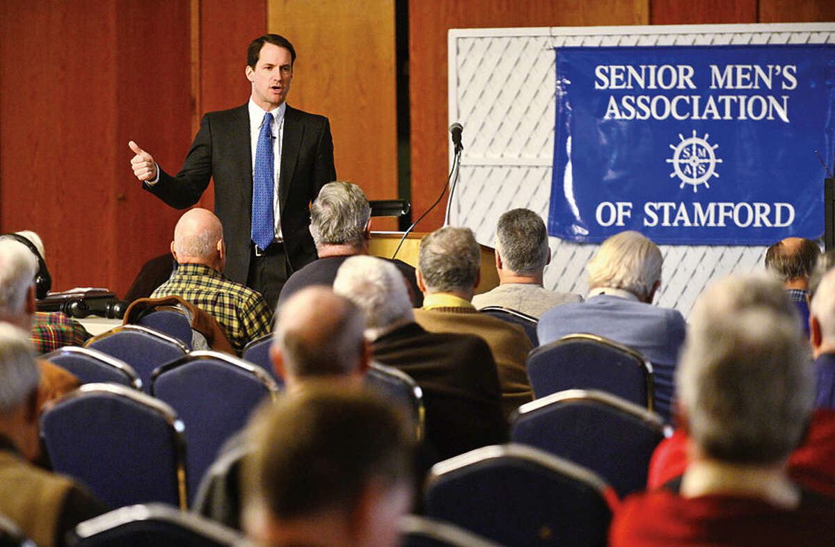 Hour photo / Erik Trautmann U.S. Representitive Jim Himes speaks on a variety of issues to The Senior Men's Association at the Temple Agudath Shalom on Strawberry Hill Avenue in Stamford Thursday.