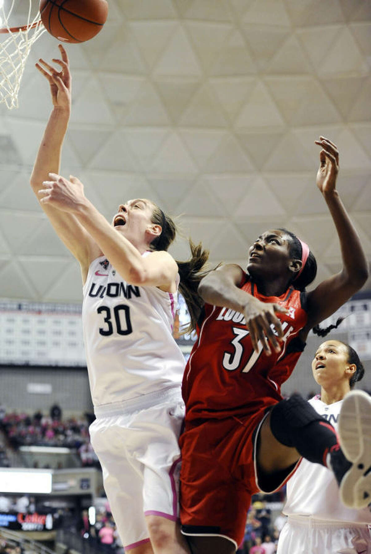 Connecticut's Breanna Stewart, left, and Louisville's Asia Taylor, battle for a rebound during the second half of an NCAA women's college basketball game, Sunday, Feb. 9, 2014, in Storrs, Conn. Connecticut won 81-64. (AP Photo/Jessica Hill)