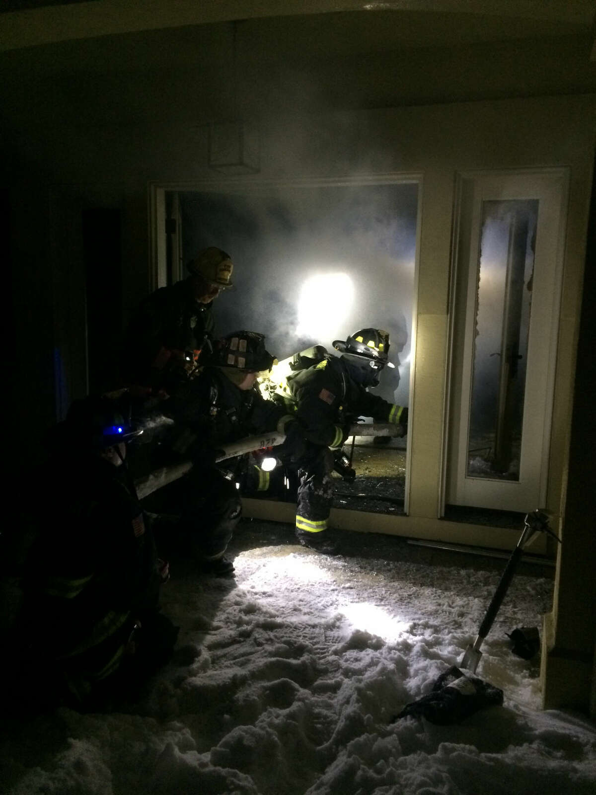 Contributed photo Westport firefighters fight a small blaze on Weathervane Hill Road Wednesday night.