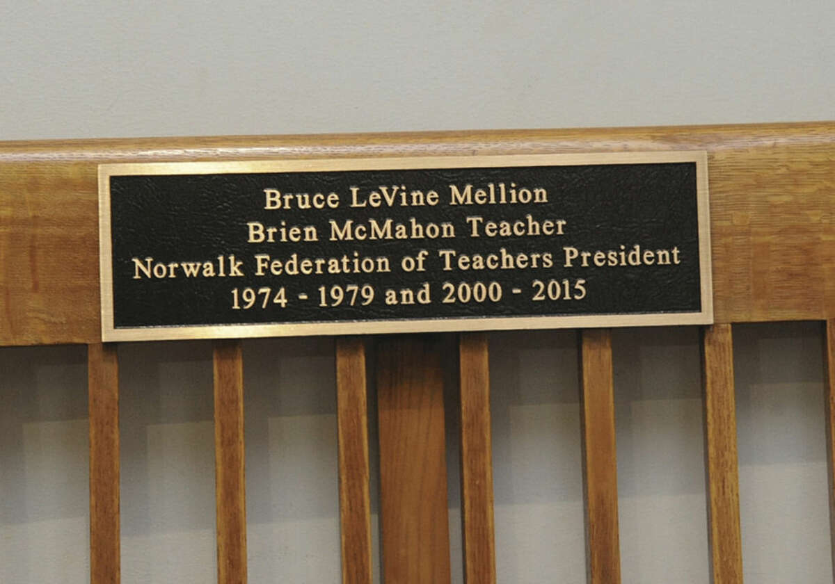 Hour photo/Matthew Vinci The bench outside the Board of Education room at Norwalk City Hall was dedicated Tuesday to Bruce Mellion, former Norwalk Federation of Teachers president.