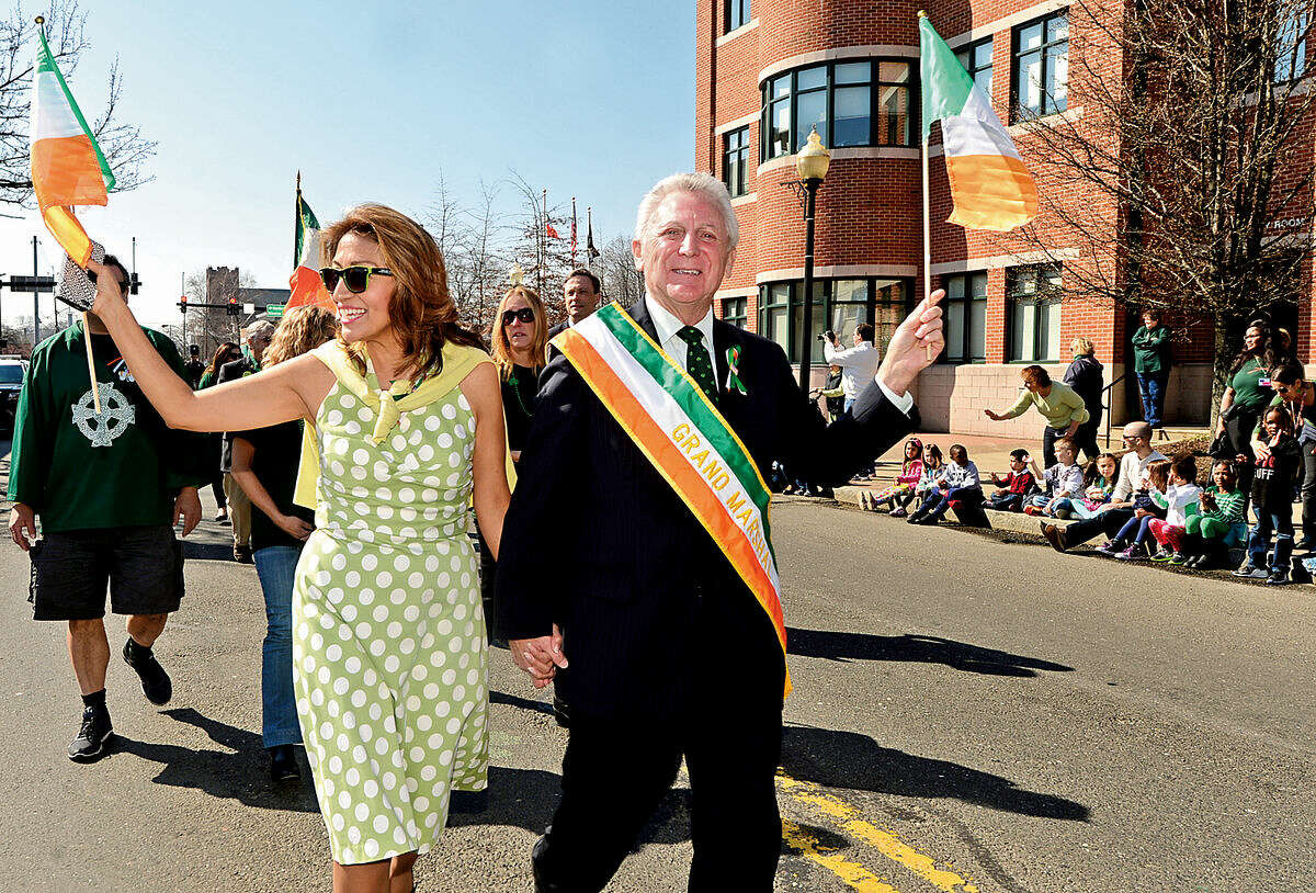 Hour photo / Erik Trautmann Norwalk mayor Harry Rilling, who was named Grand Marshal, and his wife Lucia march in the first Norwalk St. Patrick's Day parade Thursday which made it's way down South and North Main Streets ending at O'Neill's Pub.
