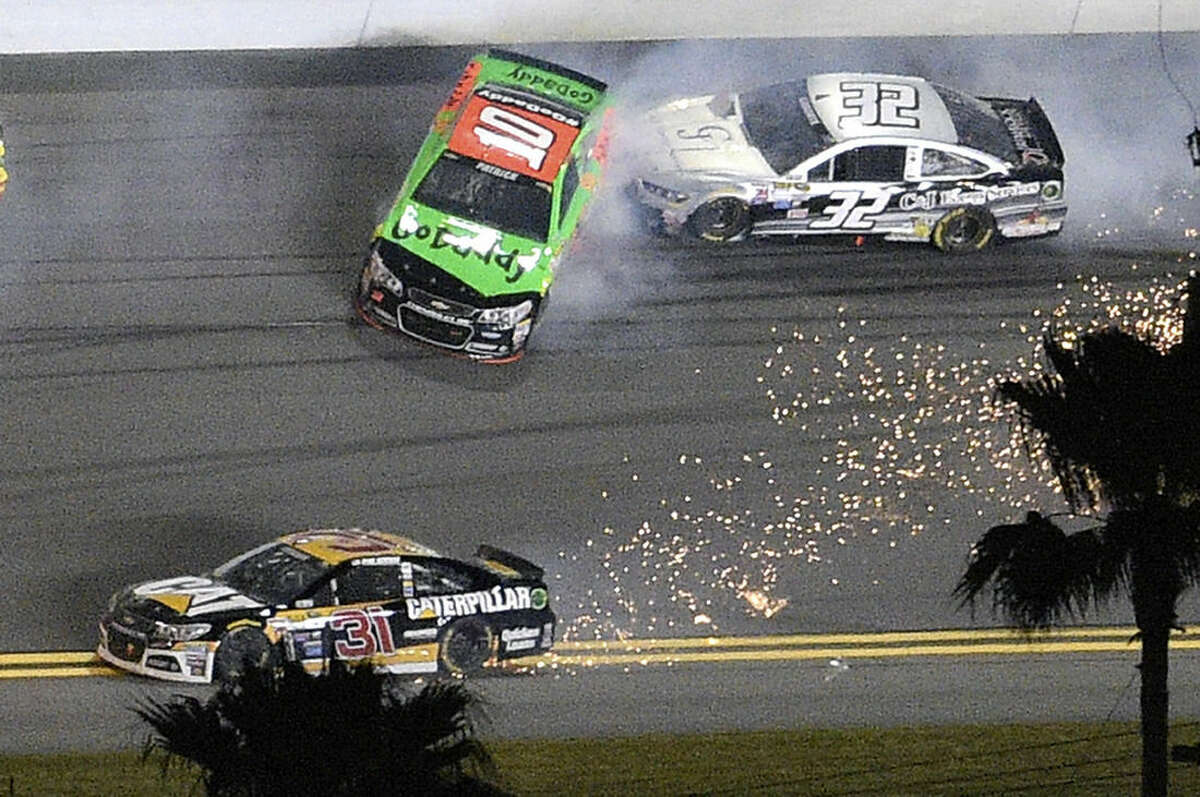 Danica Patrick (10) and Bobby Labonte (32) collide between Turns 3 and 4 as Ryan Newman (31) tries to avoid them during the second of two qualifying races for the Daytona 500 NASCAR Sprint Cup series auto race at Daytona International Speedway, Thursday, Feb. 19, 2015, in Daytona Beach, Fla. (AP Photo/Phelan M. Ebenhack)