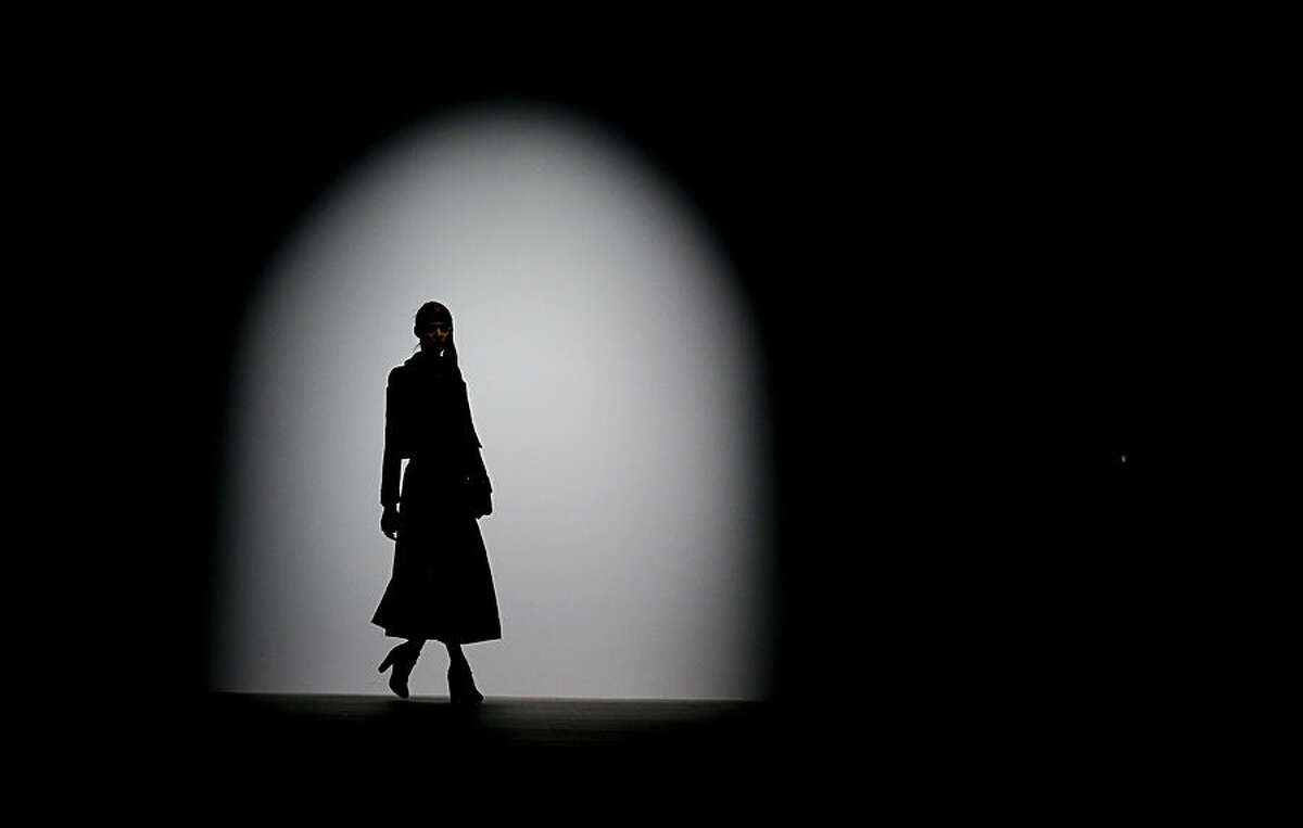 A model wears an outfit by designer Bora Aksu during the Autumn/Winter 2015 show at London Fashion Week in London, Friday, Feb. 20, 2015. (AP Photo/Kirsty Wigglesworth)