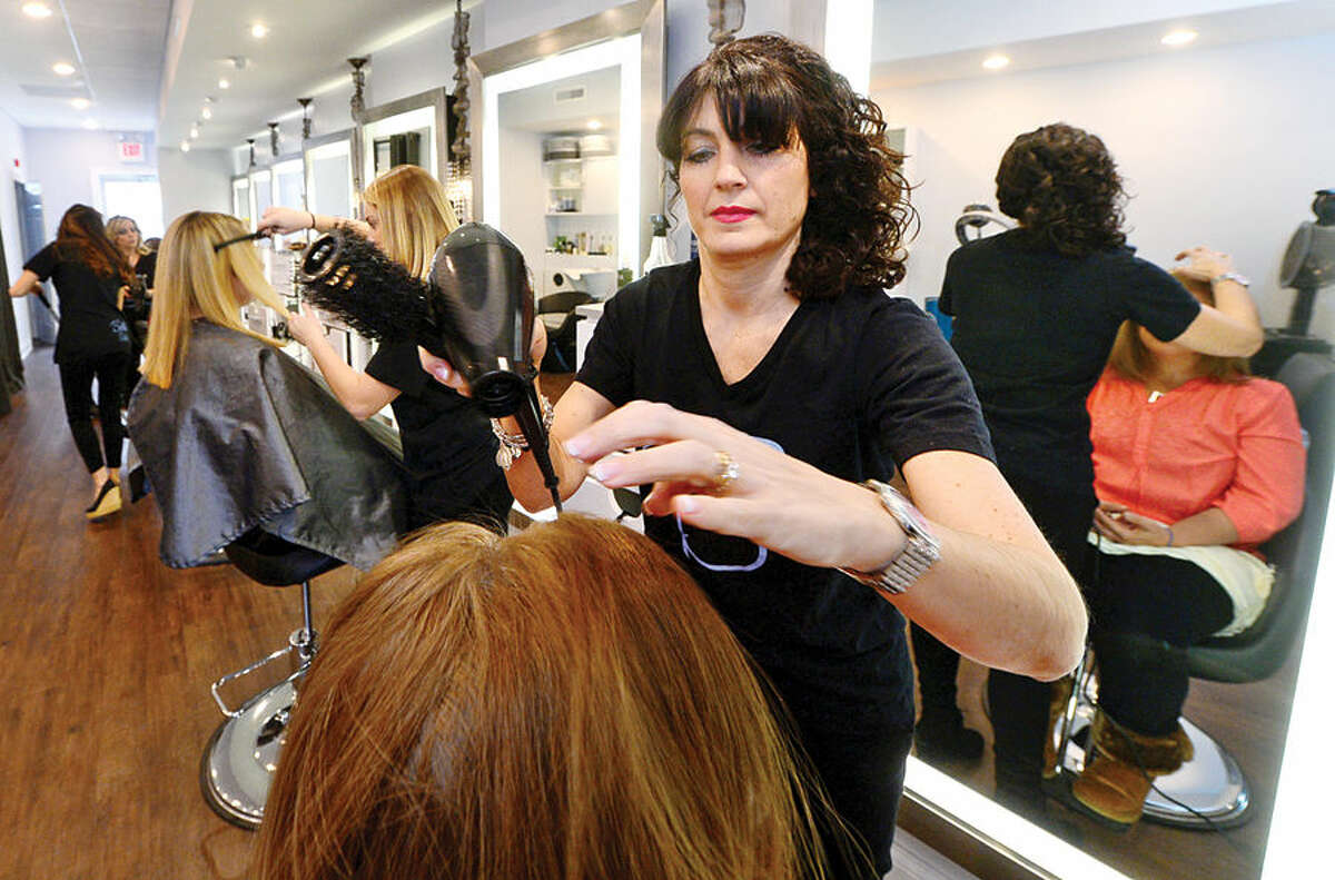 Hour photo / Erik Trautmann Donna Capomolla, owner of Bella Salon on High Ridge Road in Stamford, has opened a new salon in the same space where she owned Double Take Salon in the 90's but sold it after giving birth to a child.