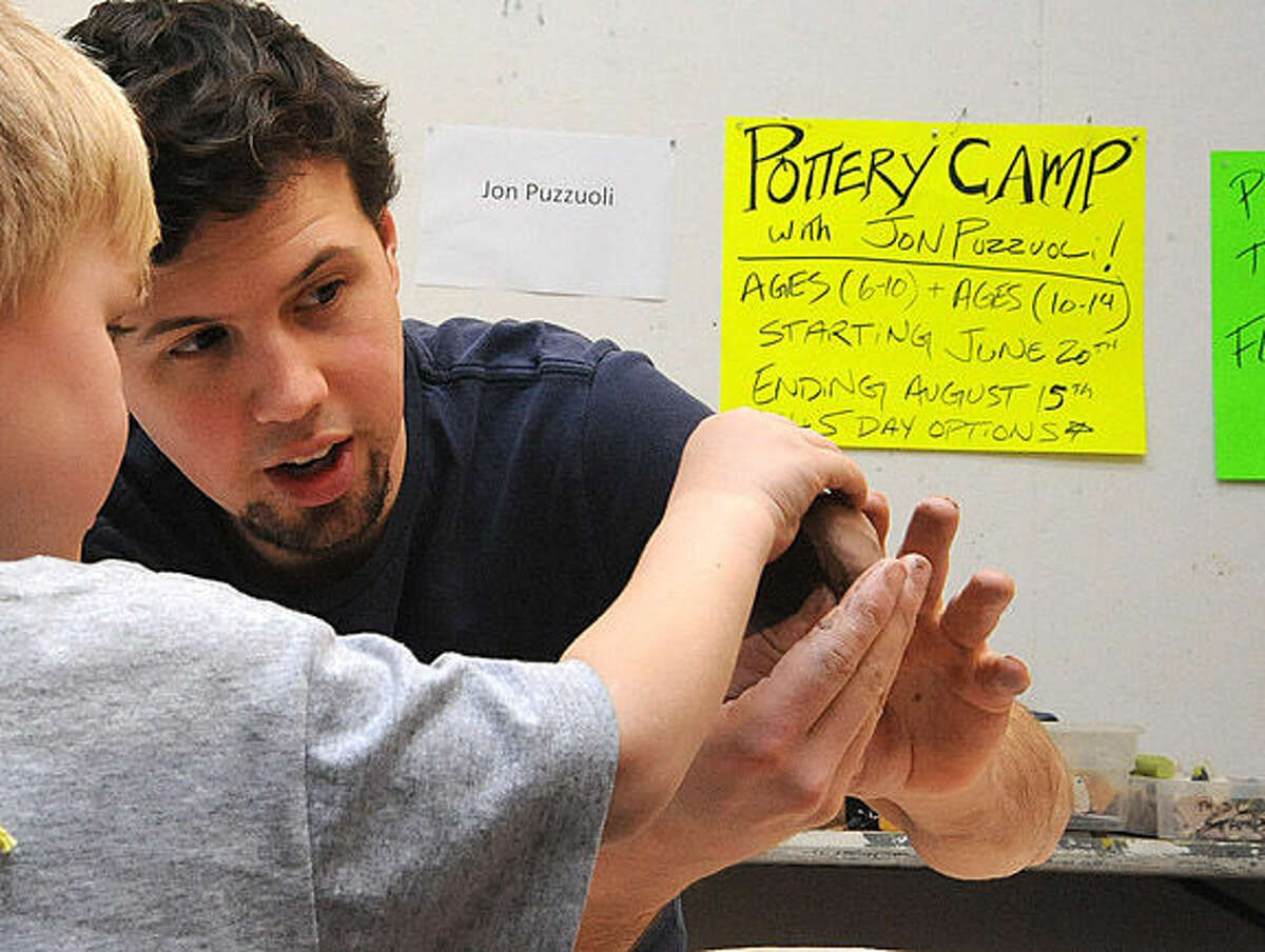 Jon Puzzuoli is the pottery camp teacher giving lessons Sunday at the Silvermine Arts Center Summer Camp Open House. Hour photo/Matthew Vinci