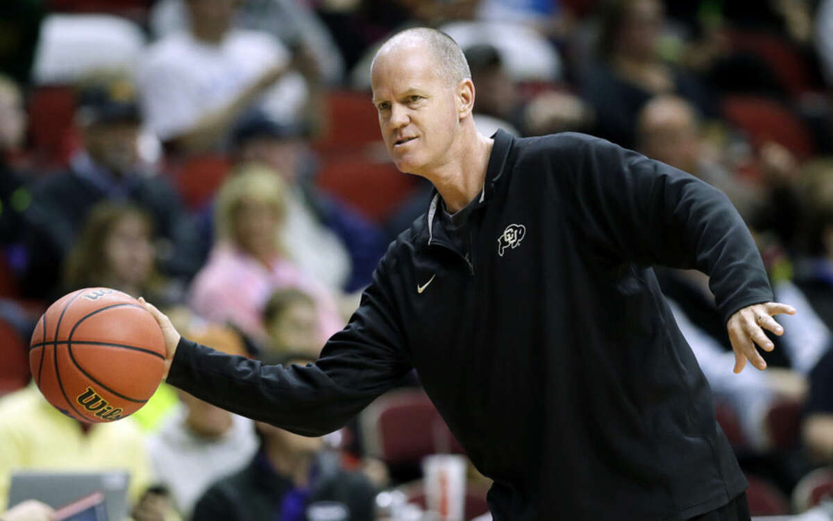 Colorado head coach Tad Boyle throws a pass during practice for a first-round men's college basketball game in the NCAA Tournament, Wednesday, March 16, 2016, in Des Moines, Iowa. Colorado will play Connecticut on Thursday. (AP Photo/Charlie Neibergall)