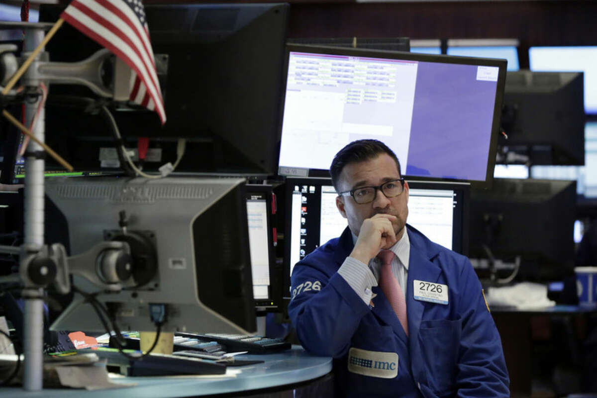 Specialist Paul Cosentino waits for trading to begin on the floor of the New York Stock Exchange, Tuesday, March 15, 2016. U.S. stocks tumbled in the first minutes of trading as falling commodity prices again pulled energy and materials companies lower. (AP Photo/Richard Drew)