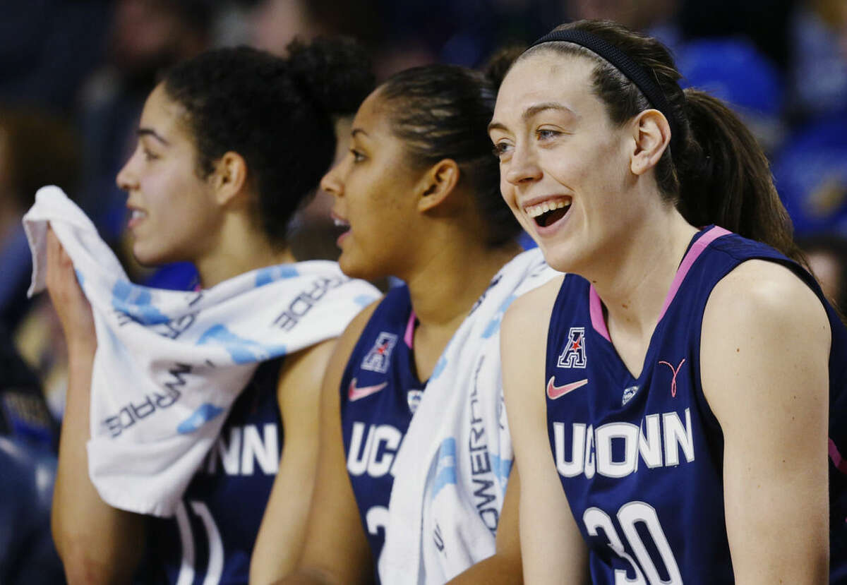 Connecticut forward Breanna Stewart smiles on the bench in the second half of an NCAA college basketball game against Tulsa in Tulsa, Okla., Saturday, Feb. 21, 2015. Connecticut won 92-46. (AP Photo/Sue Ogrocki)