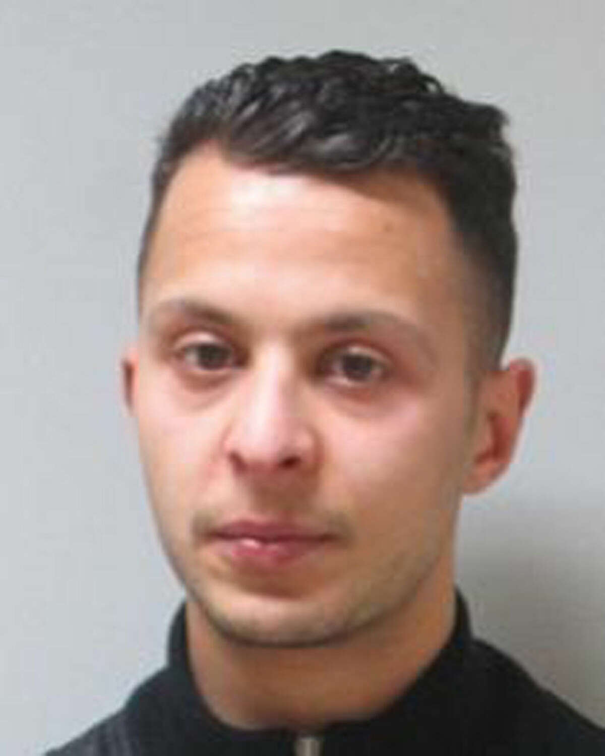 This undated file photo provided by the Belgian Federal Police shows 26-year old Salah Abdeslam, who is wanted by police in connection with recent terror attacks in Paris. Belgian prosecutors said Friday March 18, 2016 that fingerprints of Paris attacks fugitive Salah Abdeslam found in Brussels apartment that was raided earlier this week. (Belgian Federal Police via AP)