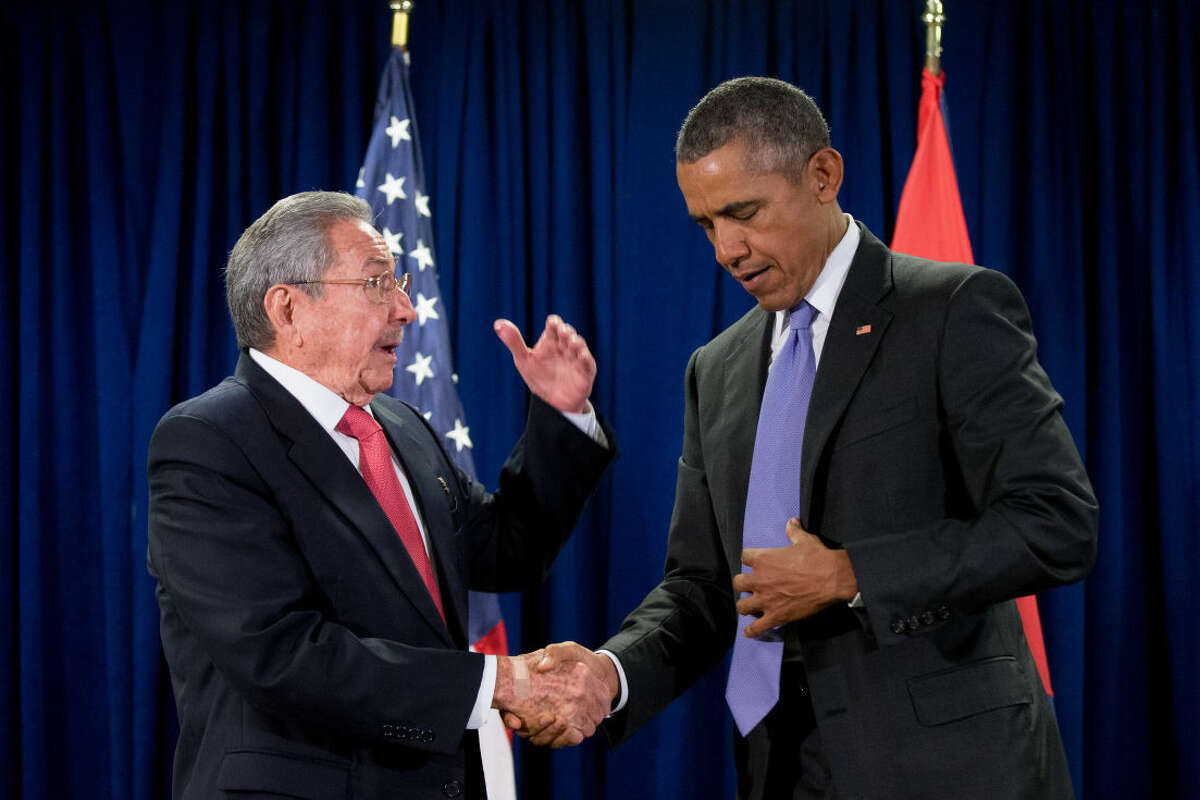FILE - In this Sept. 29, 2015, file photo, President Barack Obama shakes hands with Cuban President Raul Castro before a bilateral meeting at United Nations headquarters. Obama will open a new era in the United States' thorny relationship with Cuba during a history-making trip that has two seemingly dissonant goals: locking in his softer approach while also pushing Cuba's communist leaders to change their ways. (AP Photo/Andrew Harnik, File)