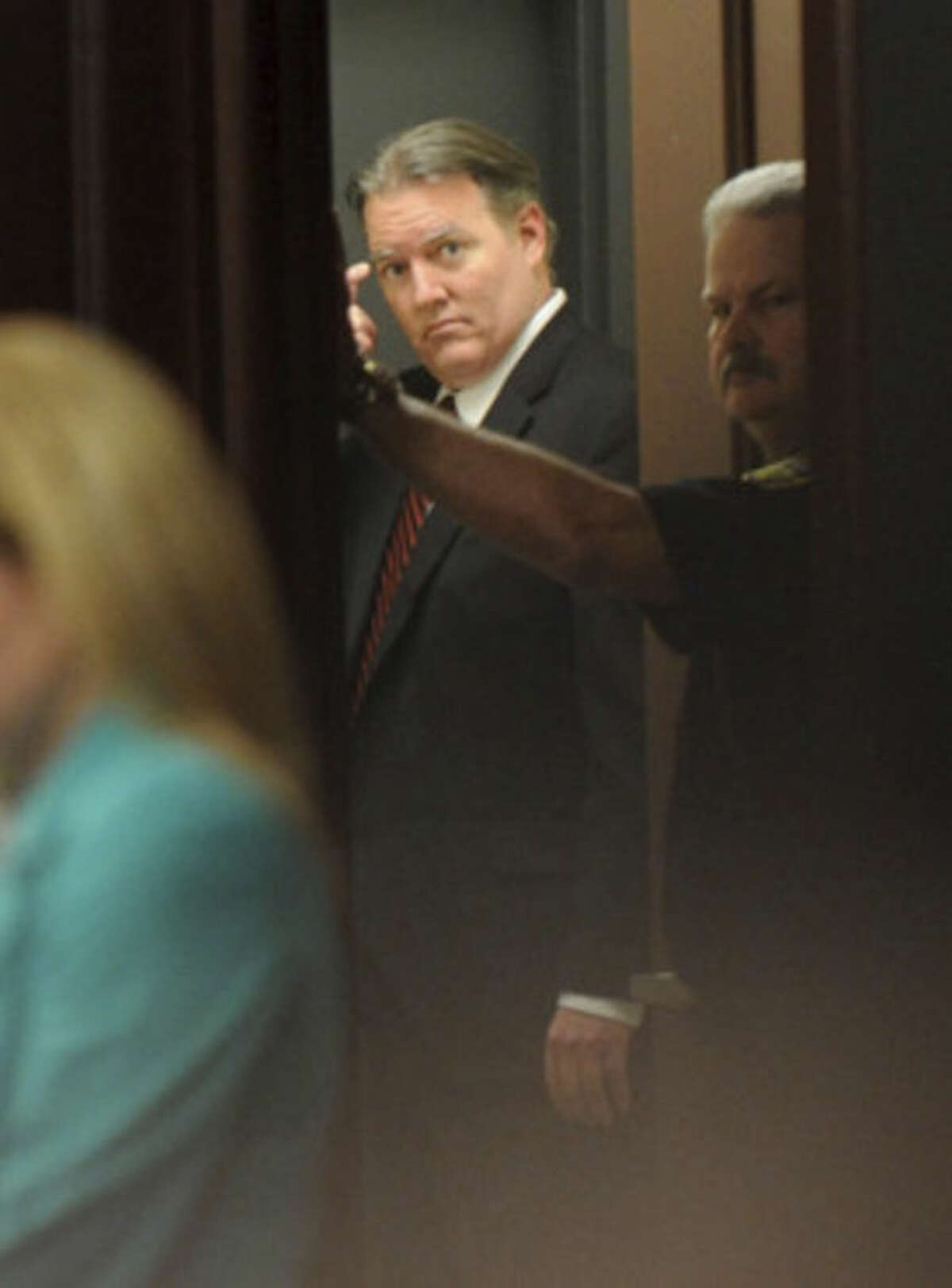 Michael Dunn leaves the courtroom after the verdict is read in Jacksonville, Fla. Saturday, Feb. 15, 2014. Dunn was convicted of attempted murder in the shooting death of a teenager during an argument over loud music, but jurors could not agree on the most serious charge of first-degree murder. (The Florida Times-Union, Bob Mack, Pool)