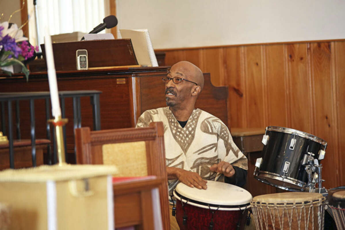 Michael Mills from Drums Not Guns plays the drums at St. James Church.
