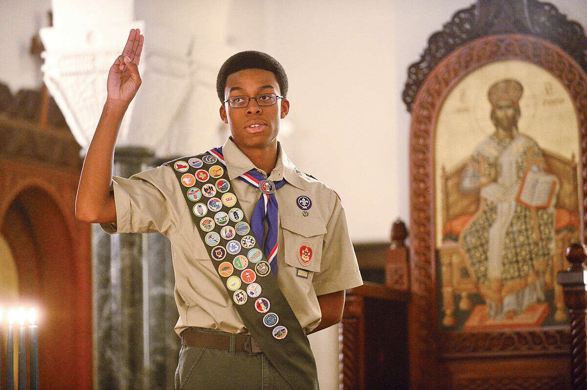 Hour photo / Erik Trautmann Sean Walters is honored during the Boy Scout Eagle Court of Honor ceremony at St. George Greek Orthodox Church where Walters was awarded the Eagle Scout Badge with the help of his family and dignitaries Saturday afternoon.