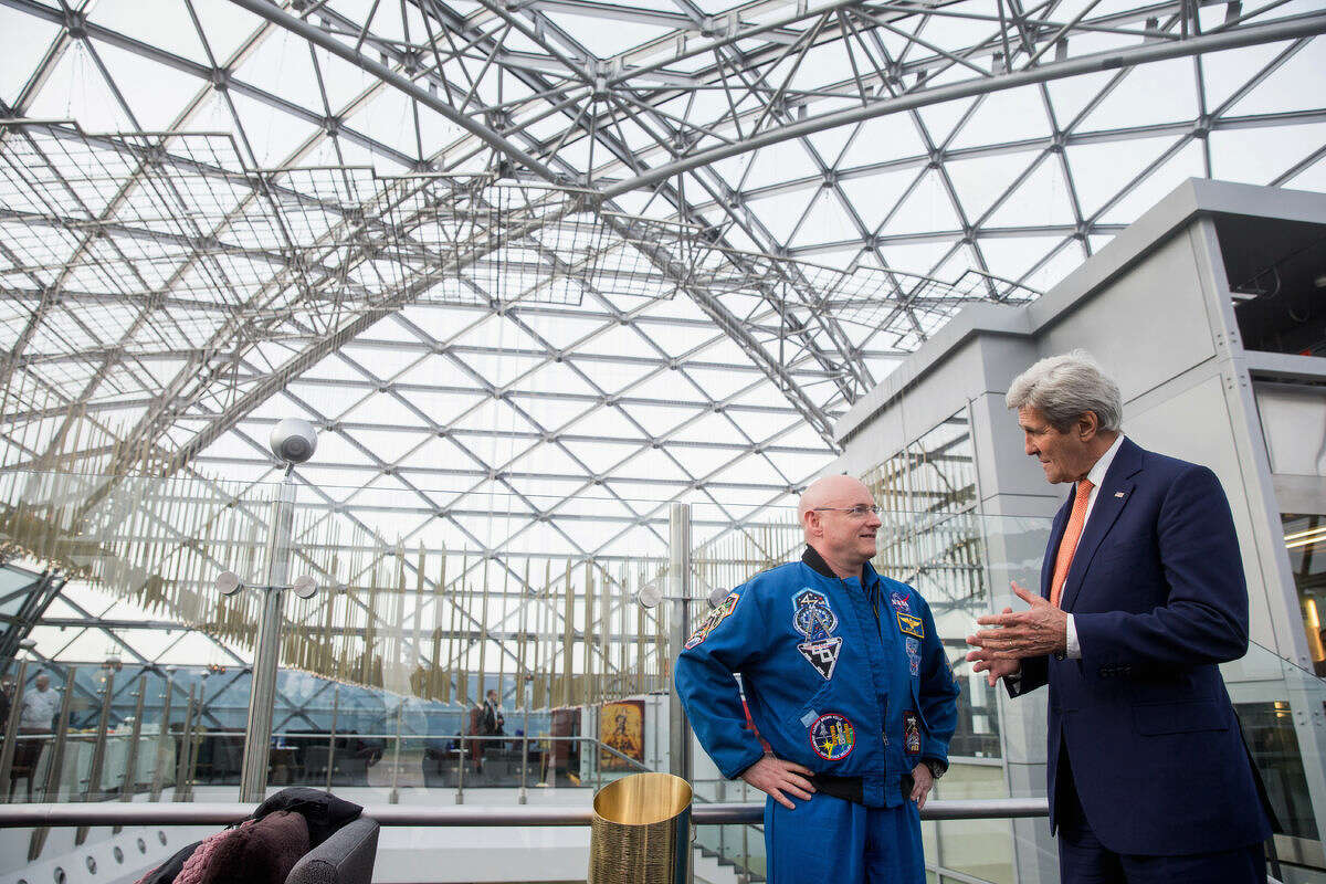 Secretary of State John Kerry meets with astronaut Scott Kelly at the Ritz-Carlton Hotel in Moscow, Russia, Thursday, March 24, 2016. Kerry is in Russia for talks on Ukraine and Syria as the terrorist attacks in Brussels underscored the urgency of fighting the Islamic State group. (AP Photo/Andrew Harnik, Pool)