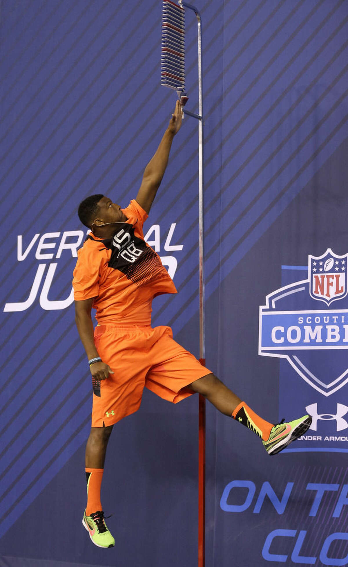 Florida State quarterback Jameis Winston leaps during the vertical jump drill at the NFL football scouting combine in Indianapolis, Saturday, Feb. 21, 2015. (AP Photo/David J. Phillip)
