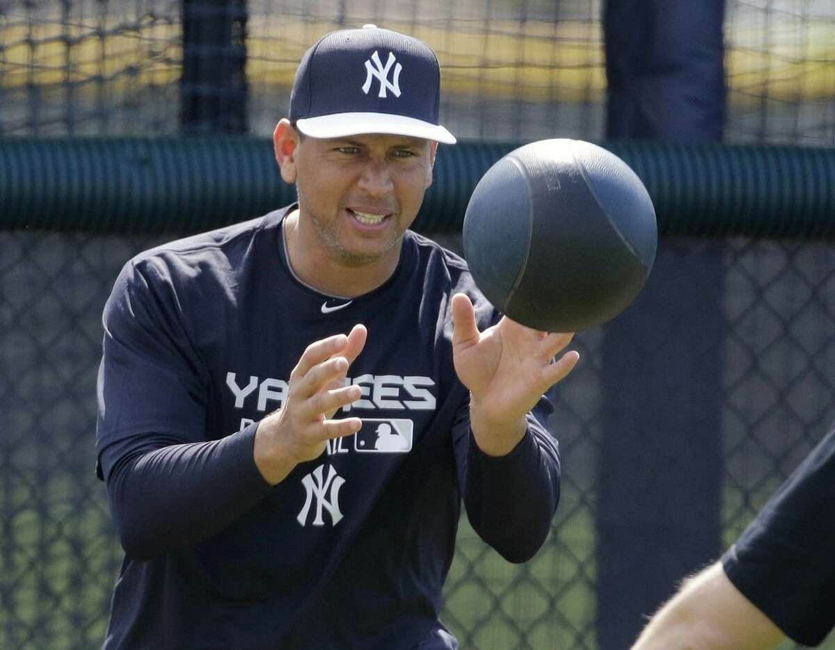 New York Yankees' Alex Rodriguez works out at the Yankees minor league facility before reporting for spring training baseball, Monday, Feb. 23, 2015, in Tampa, Fla. The official full squad workouts begin Feb. 26. (AP Photo/Chris O'Meara)