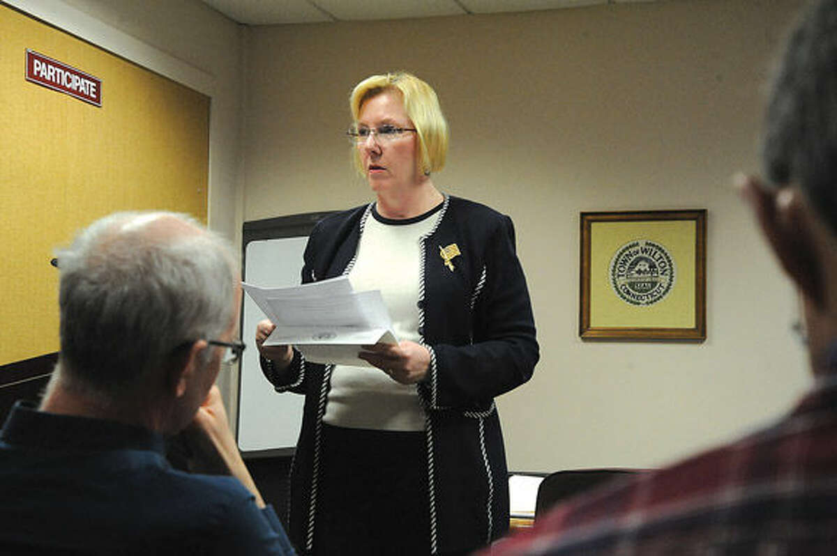 Deborah McFadden, chairman of the Wilton Democratic Town Committee, presides over the party’s caucuses Tuesday night at Town Hall.
