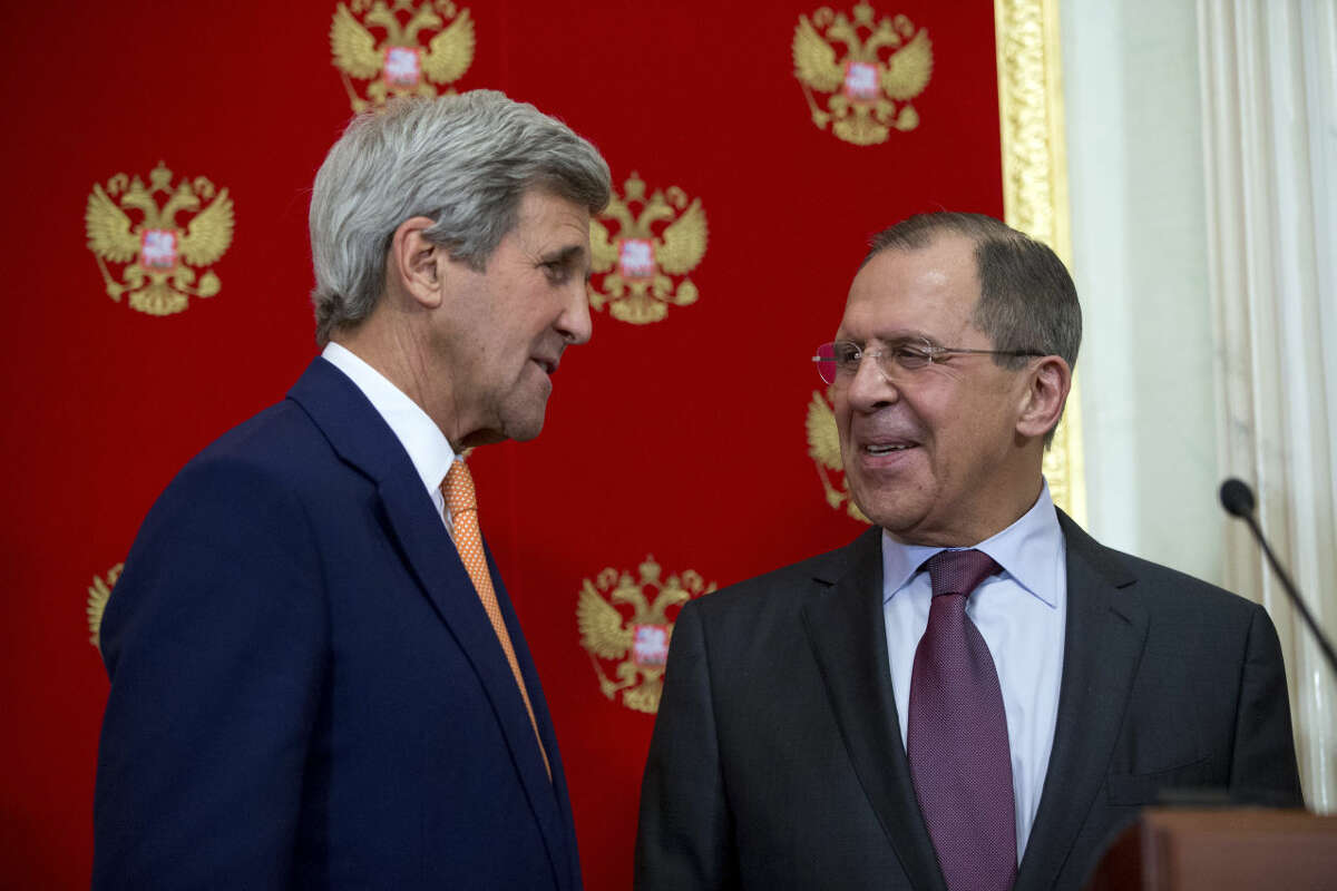 Secretary of State John Kerry and Russian Foreign Minister Sergey Lavrov speak together following a news conference at the Kremlin in Moscow, Russia, Friday, March 25, 2016, following a meeting with Russian President Vladimir Putin. (AP Photo/Andrew Harnik, Pool)