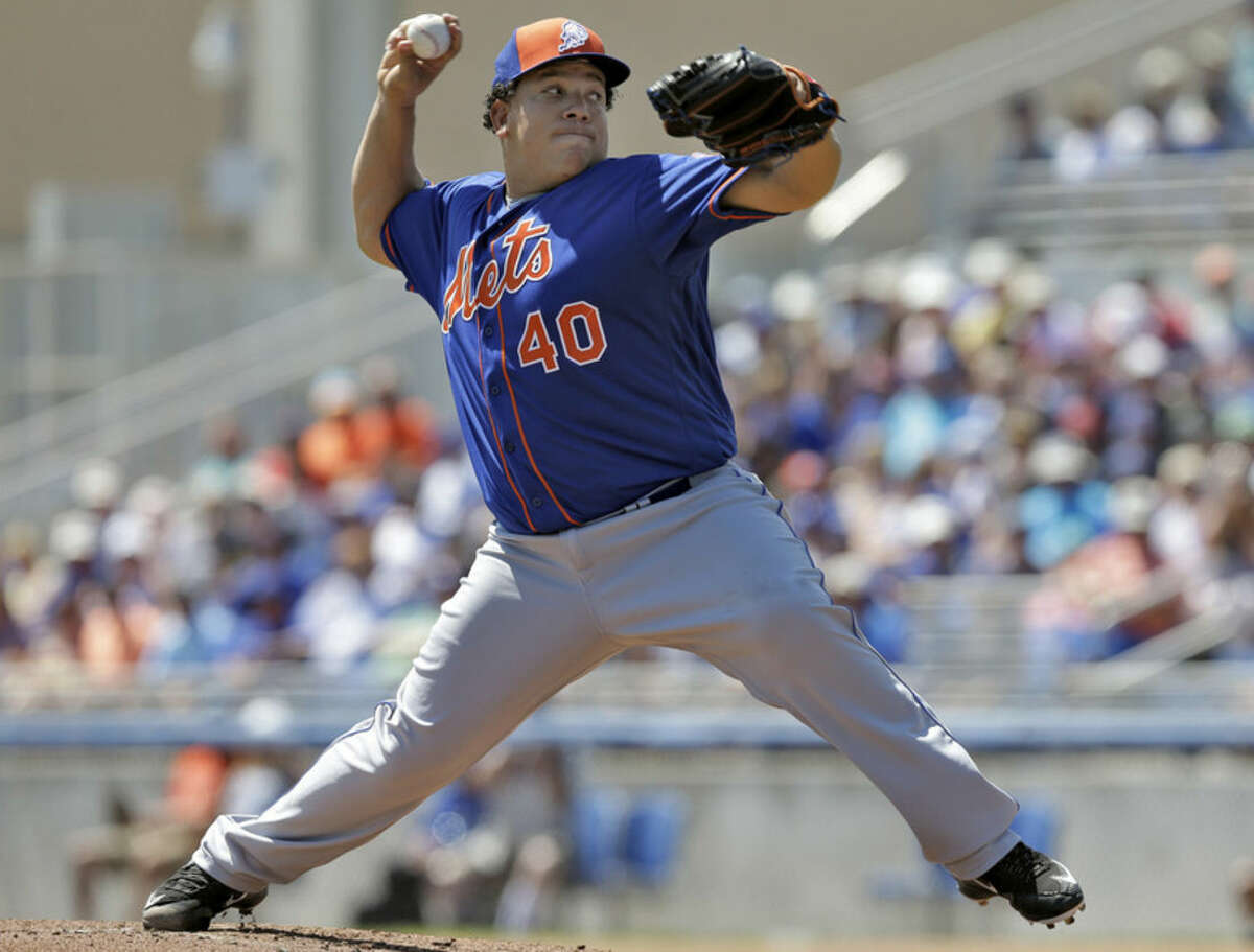 New York Mets starting pitcher Bartolo Colon delivers to the Toronto Blue Jays during the first inning of a spring training baseball game Wednesday, March 23, 2016, in Dunedin, Fla. (AP Photo/Chris O'Meara)