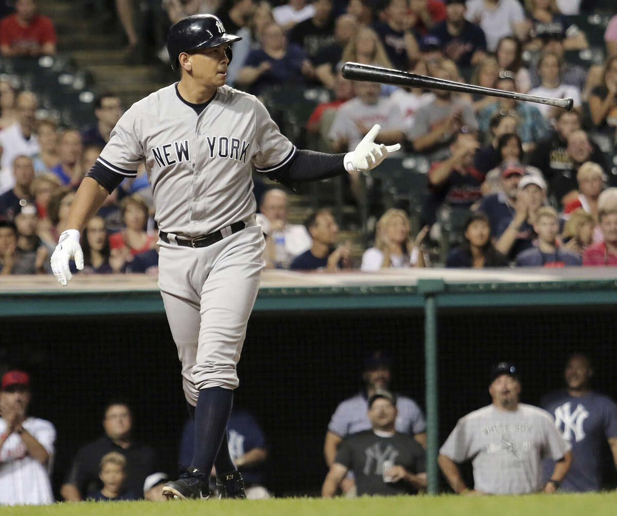 FILE - In this Aug. 13, 2015, file photo, New York Yankees Alex Rodriguez flips his bat after striking out in the eighth inning of a baseball game against the Cleveland Indians in Cleveland. Rodriguez says he plans to retire from baseball after the 2017 season. The Yankees slugger revealed his intentions Wednesday, March 23, 2016, during an interview with ESPN. His plans were confirmed by spokesman Ron Berkowitz. (AP Photo/Aaron Josefczyk, File)