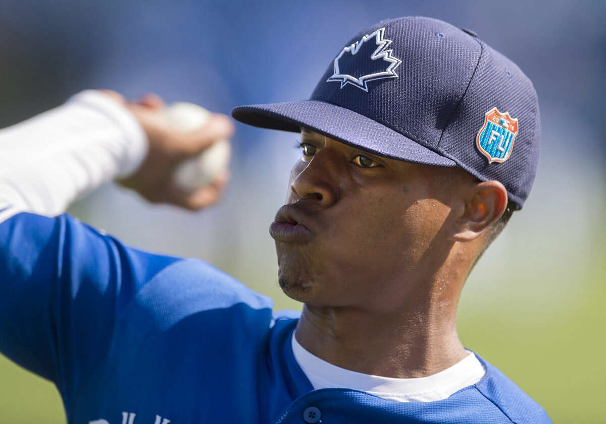 FILE - In this Feb. 29, 2016, file photo, Toronto Blue Jays pitcher Marcus Stroman warms up at spring training baseball practice in Dunedin, Fla. Stroman will be the Blue Jays' starter April 3, 2016, in the American League opener at Tampa Bay, manager John Gibbons announced Wednesday, march 23, 2016. (Frank Gunn/The Canadian Press via AP, File) MANDATORY CREDIT