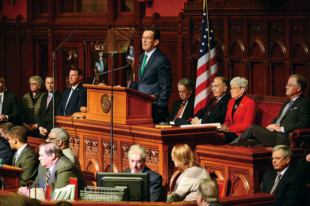 Hour photo / Erik Trautmann Connecicut Governor Dannel Malloy gives his budget address to the joint legislative session Wednesday at the state capitol in Hartford.