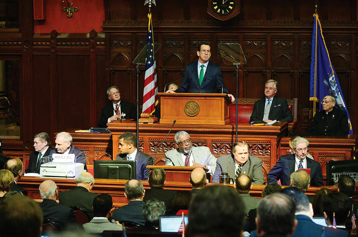 Hour photo / Erik Trautmann Connecicut Governor Dannel Malloy gives his budget address to the joint legislative session Wednesday at the state capitol in Hartford.