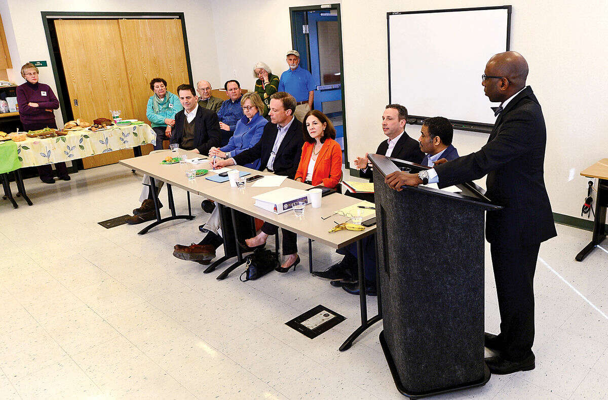 Hour photo / Erik Trautmann Moderator Darnell D. Crosland listens as Norwalk State legislators answer questions and talk about the current legislative session during The League of Women Voters of Norwalk annual Pie and Politics event Saturday, March 19, 2016 in the Norwalk Police Department Community Room.