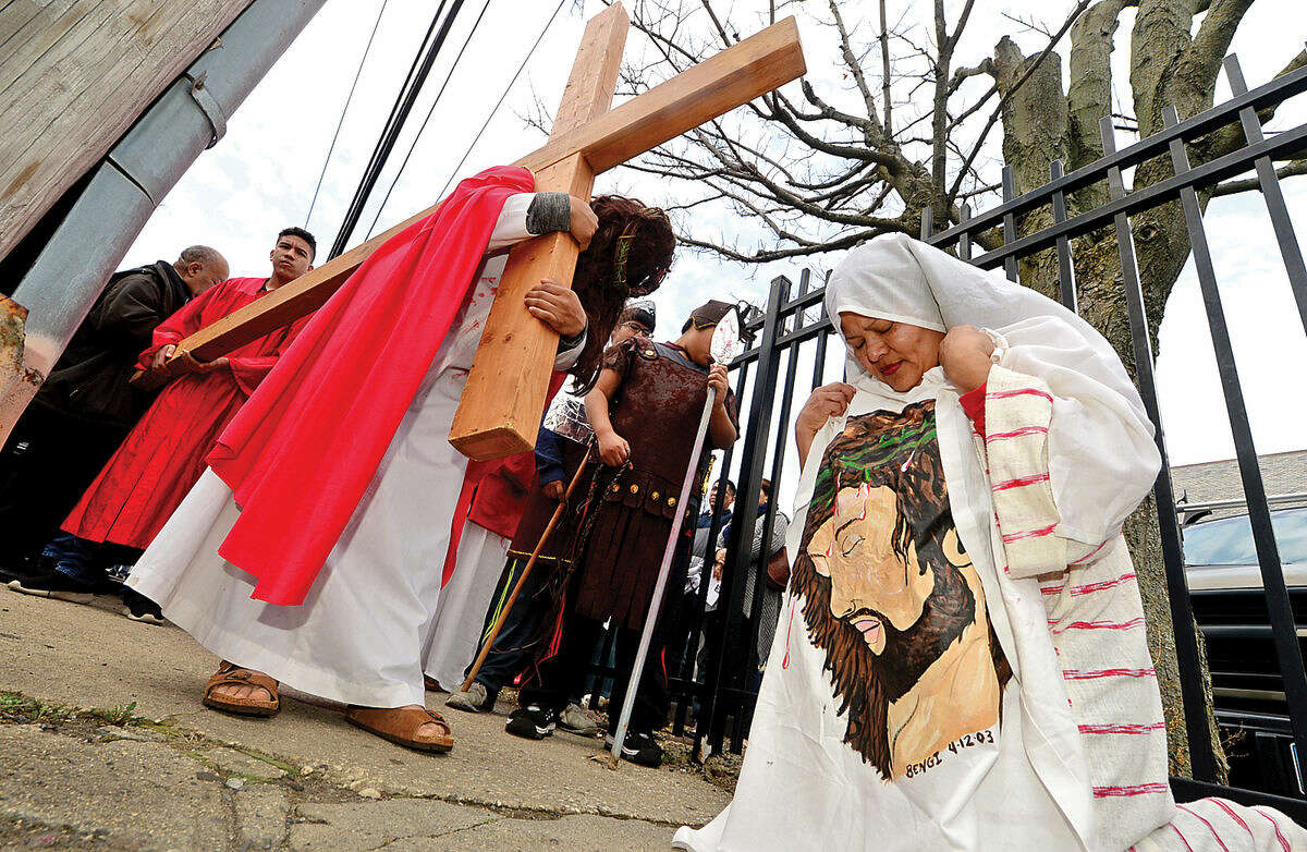 Hour photo / Erik Trautmann Darwin Aplacano portrays Jesus as nearly 100 parishioners of St. Joseph Church observe the Living Stations of the Cross at the church in South Norwalk on Good Friday.