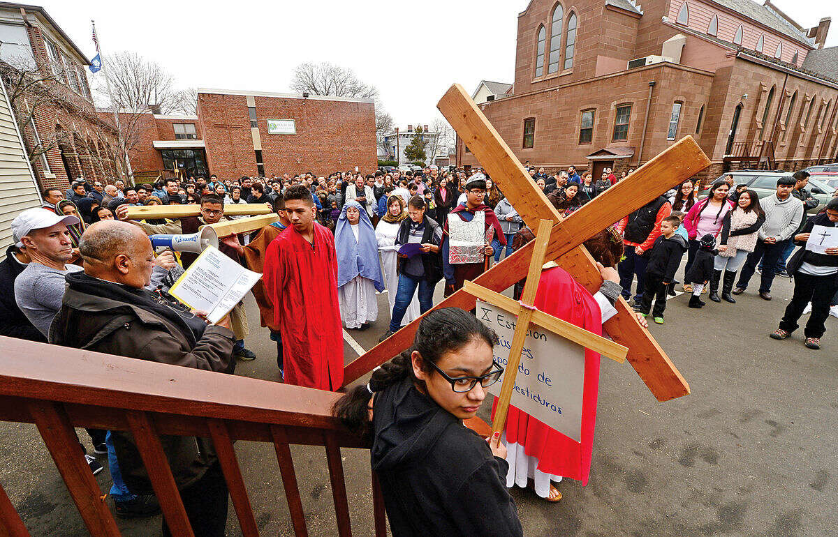 Hour photo / Erik Trautmann Nearly 100 parishioners of St. Joseph Church observe the Living Stations of the Cross at the church in South Norwalk on Good Friday.