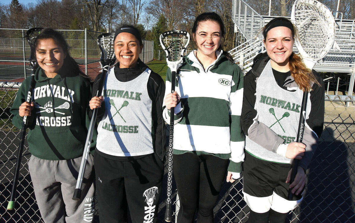 Hour photo/John Nash - Norwalk High girls lacrosse captains include, from left, Sara Meza, Arissa Troy, Brianna Fitzgerald and Maria Bellos.