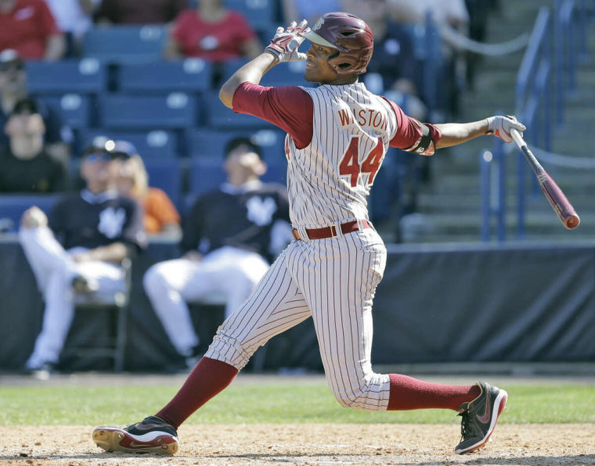 Florida State's Jameis Winston swings at an eighth inning pitch during a spring training exhibition game against the New York Yankees Tuesday, Feb. 25, 2014, in Tampa, Fla. He eventually struck out. Winston is the 2013 Heisman Trophy winner. (AP Photo/Chris O'Meara)