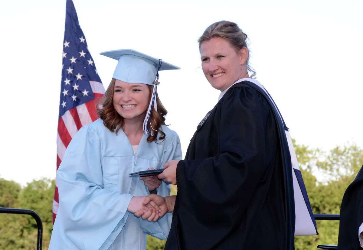 Haley Rose Guliuzza receives her diploma from Oxfords Principal, Dorothy Potter, during Oxford High Schools Graduation ceremony in Oxford, Conn. that was held on Friday June 10, 2016.
