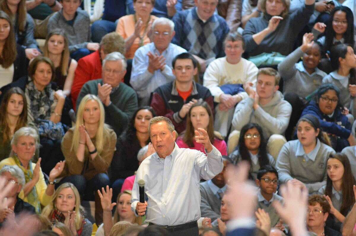 Hour Photo/Alex von Kleydorff Ohio Governor and Republican Presidential candidate John Kasich answers some questions from the audience during a Town Hall Metting at Sacred Heart University in Fairfield Conn. on Friday