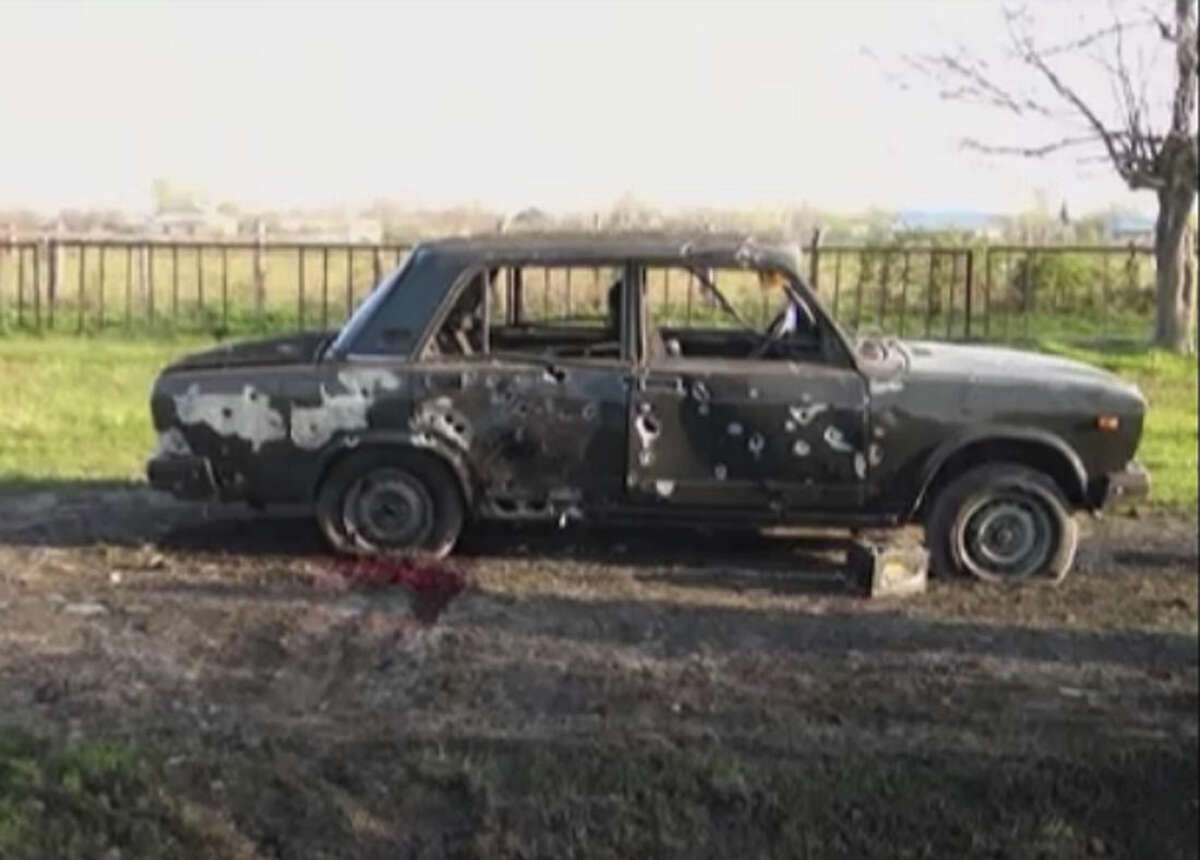 In this image from TV, a car destroyed with blood showing in the aftermath after heavy fighting erupted in Terter, Azerbaijan, Saturday April 2, 2016, between Armenian and Azerbaijani forces over the separatist region of Nagorno-Karabakh. Russia expressed grave concern on Saturday over the recent military conflict along the Azerbaijan-Armenia border, calling on all parties involved to stop fighting and exercise restraint. Officials from each of the former Soviet republics blamed the other on Saturday for the fighting which began overnight. (Kanal S TV via AP) TV OUT