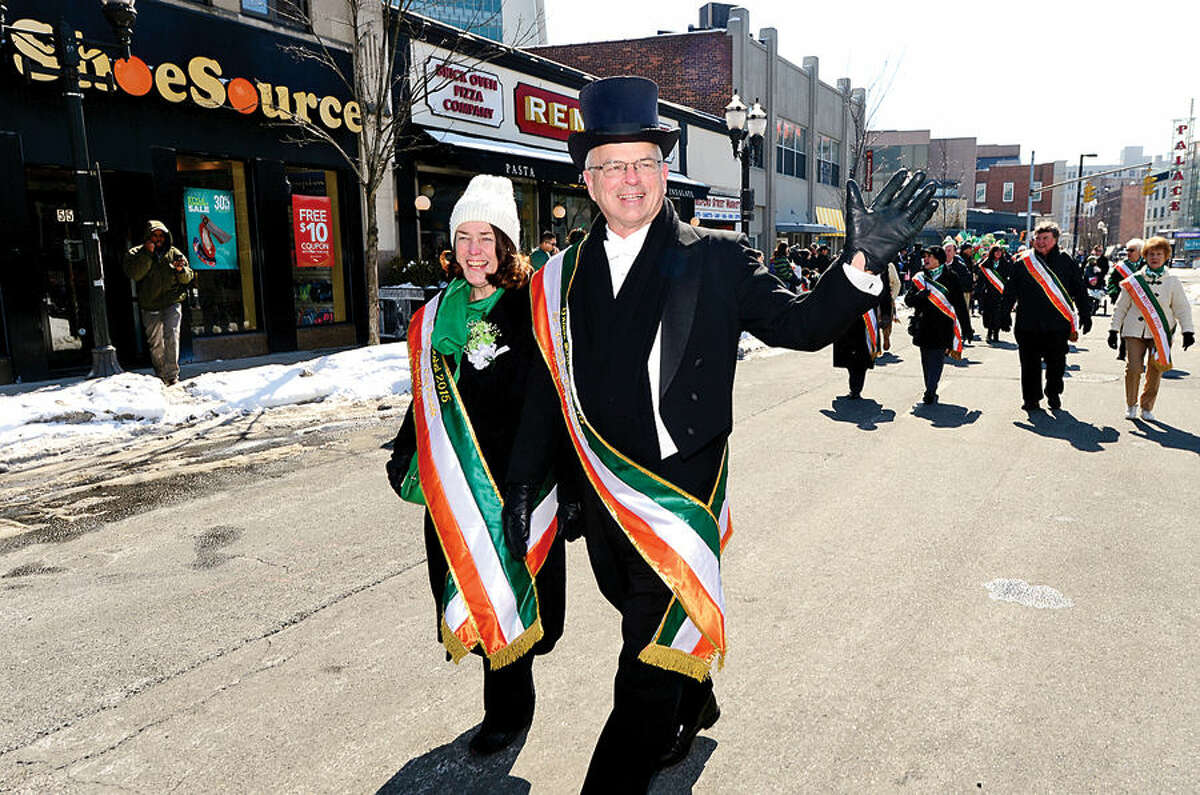 Hour photo / Erik Trautmann Stamford St Patrick's Day Parade participants and local residents including parade grand marshals Bill and Evon enjoy the sunny Saturday afternoon as the procession proceeds down Bedford St.