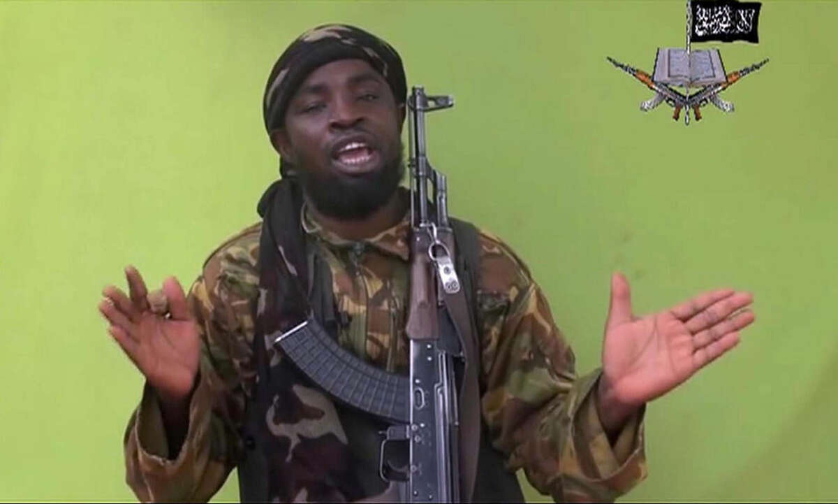 FILE -This Monday, May 12, 2014, file photo taken from video by Nigeria's Boko Haram terrorist network, shows their leader Abubakar Shekau speaking to the camera. Shekau has allegedly made a formal allegiance to the Islamic State on Saturday, March 7, 2015, in an Arabic audio message with English subtitles and was posted on Twitter, according to the SITE Intelligence monitoring service. (AP Photo, File)