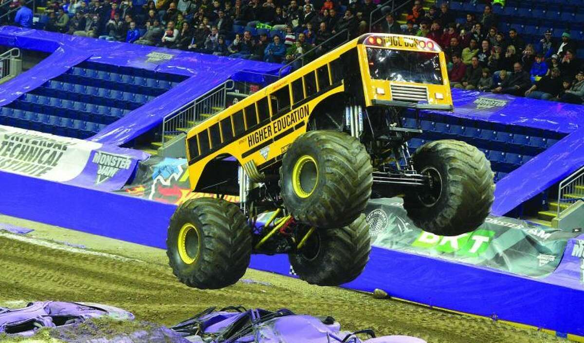 Hour Photo / Alex von Kleydorff Higher Education, driven by Jim Tracy competes in the Wheelie contest during Monster Jam at Webster Bank Arena on Friday night