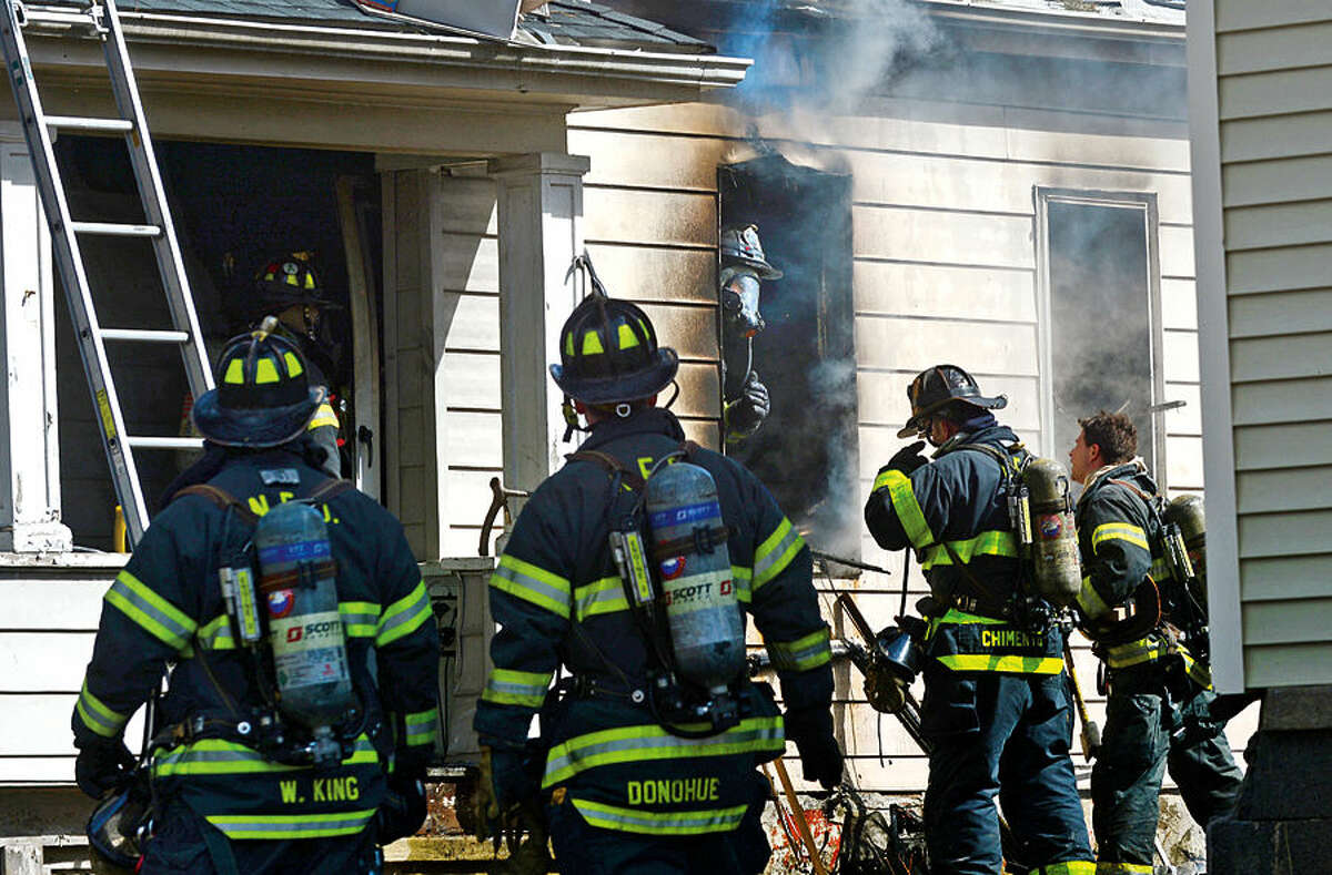 Hour photo / Erik Trautmann Emergency personnel respond to 201 Ely Avenue where a fire broke out Wednesday morning sending one victim to the hospital.