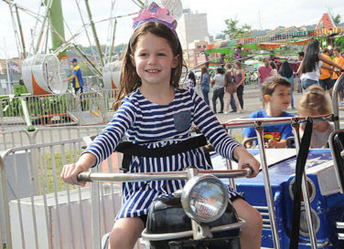 Four year old Caroline Far on a motorcycle ride Sunday at the Oyster Festival. Hour photo/Matthew Vinci