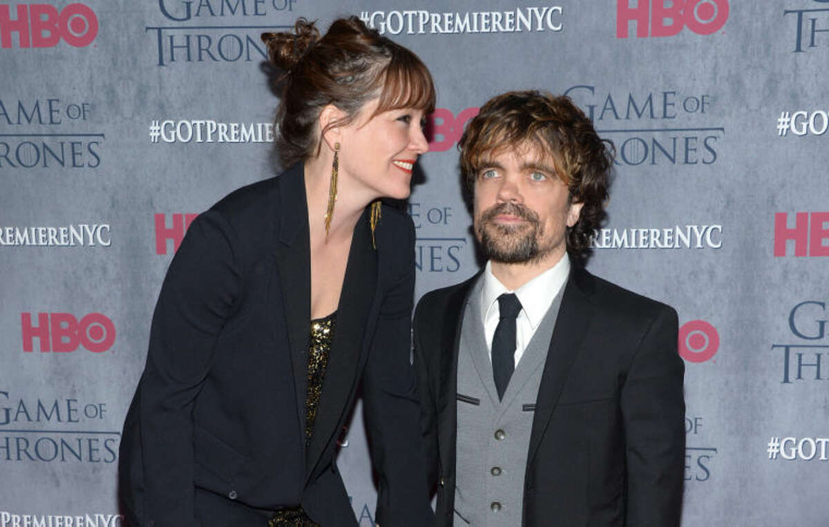 Peter Dinklage, right, and Erica Schmidt arrive at New York Premiere of "Game of Thrones" Fourth Season on Tuesday, March 18, 2014, in New York. (Photo by Evan Agostini/Invision/AP)