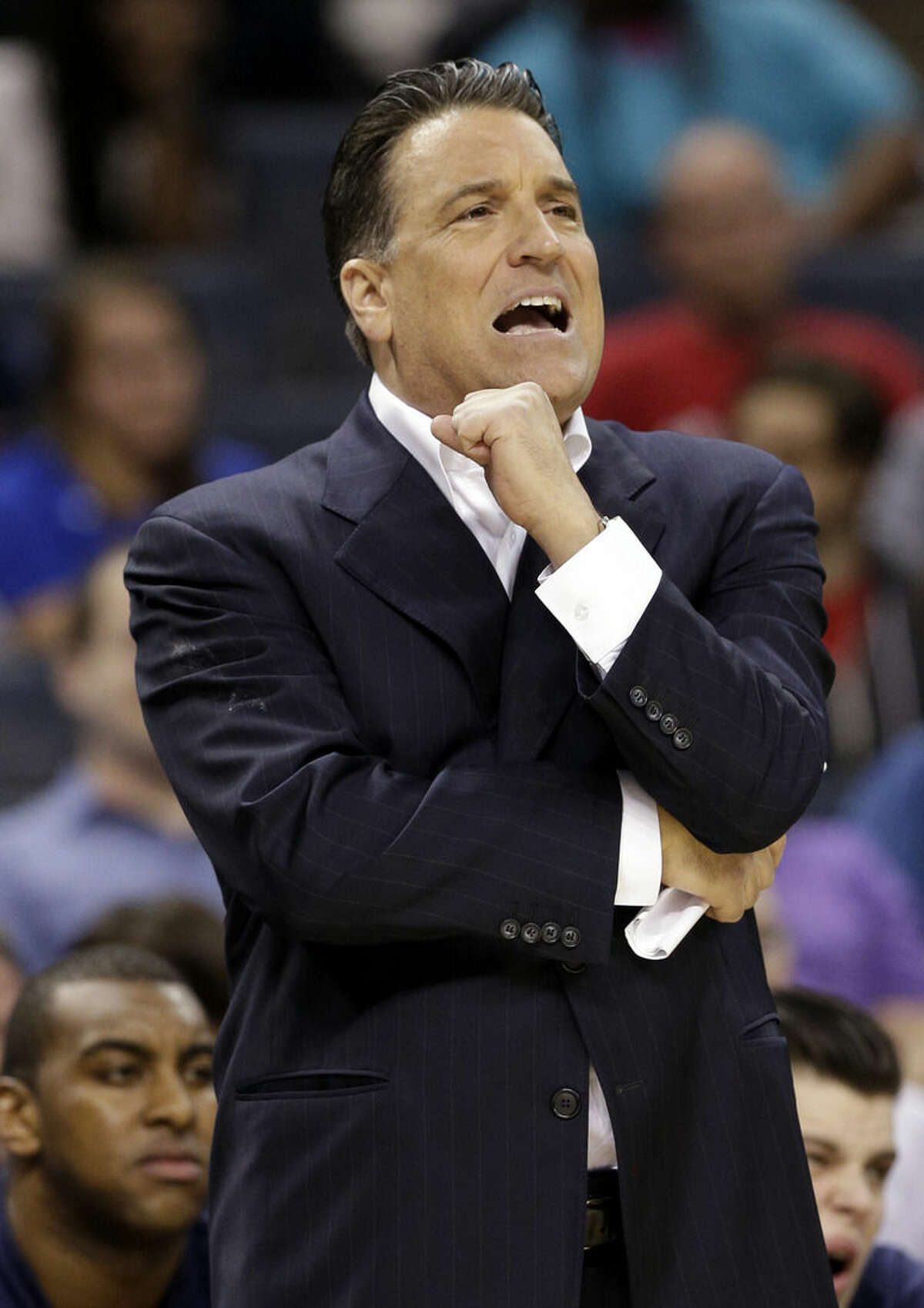 St. John's head coach Steve Lavin directs his team against San Diego State during the first half of an NCAA tournament college basketball game in the Round of 64 in Charlotte, N.C., Friday, March 20, 2015. (AP Photo/Nell Redmond)