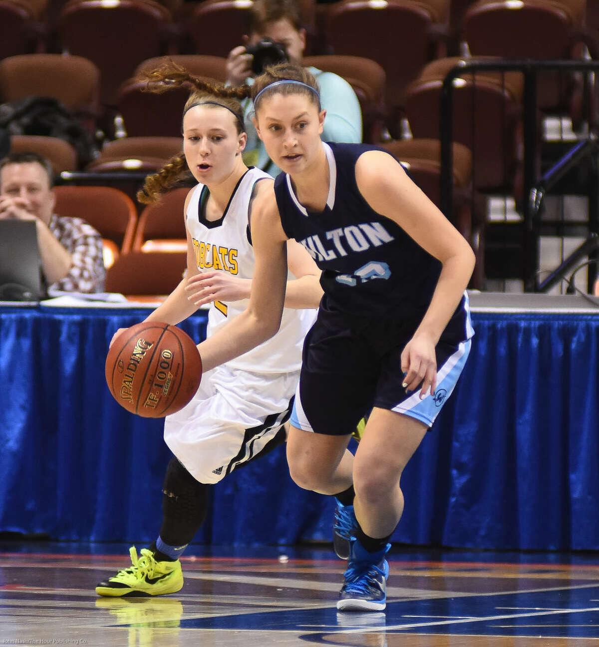 Hour photo/John Nash - Action from Saturday's CIAC Class LL girls basketball championship game between Wilton and South Windsor.