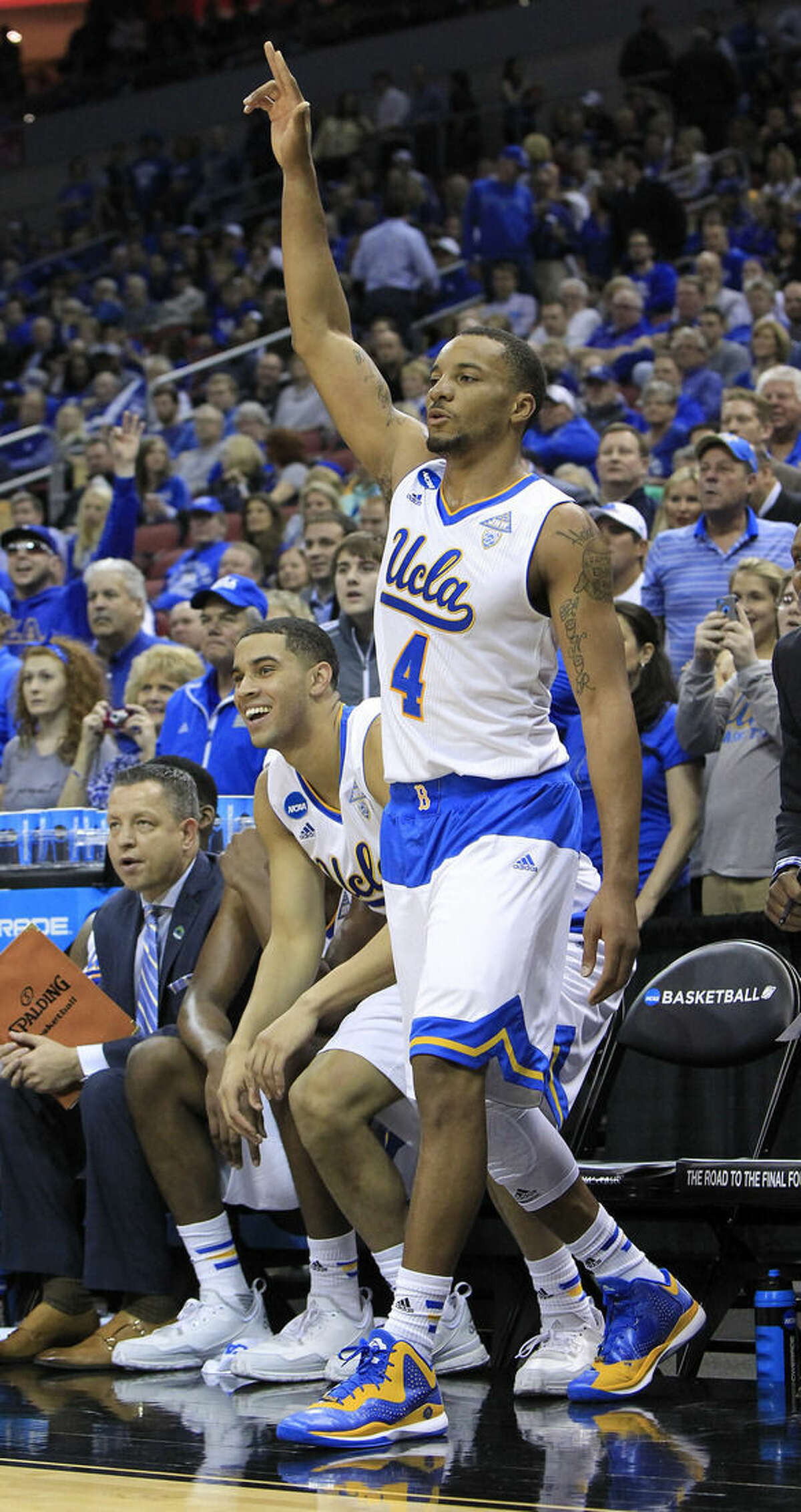 UCLA guard Norman Powell celebrates as the clock winds down during the second half of an NCAA tournament third round college basketball game in Louisville, Ky., Saturday, March 21, 2015. UCLA won the game 92-75. (AP Photo/David Stephenson)