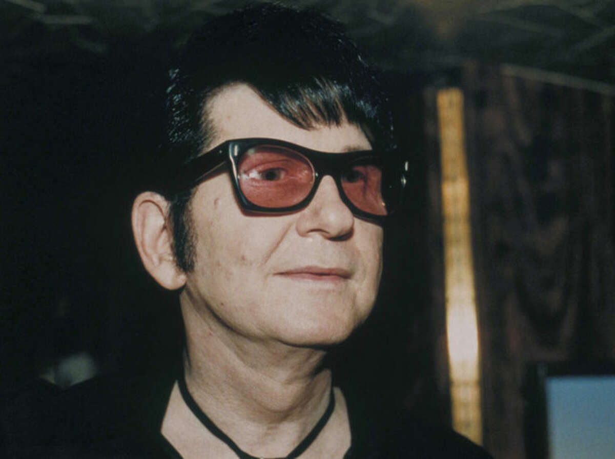 FILE - This Dec. 7, 1988 file photo shows singer and guitarist Roy Orbison, at a local night club where he was appearing in Boston, Mass. Orbison's three sons are all musicians but never really got to play music with their dad - until now. Wesley, Roy Jr. and Alex Orbison have helped create a new song by their father that will appear on the 25th anniversary reissue and expansion of Orbison's final album, "Mystery Girl" that is being re-released on May 20, 2014. (AP Photo/Julie Kramer, file)