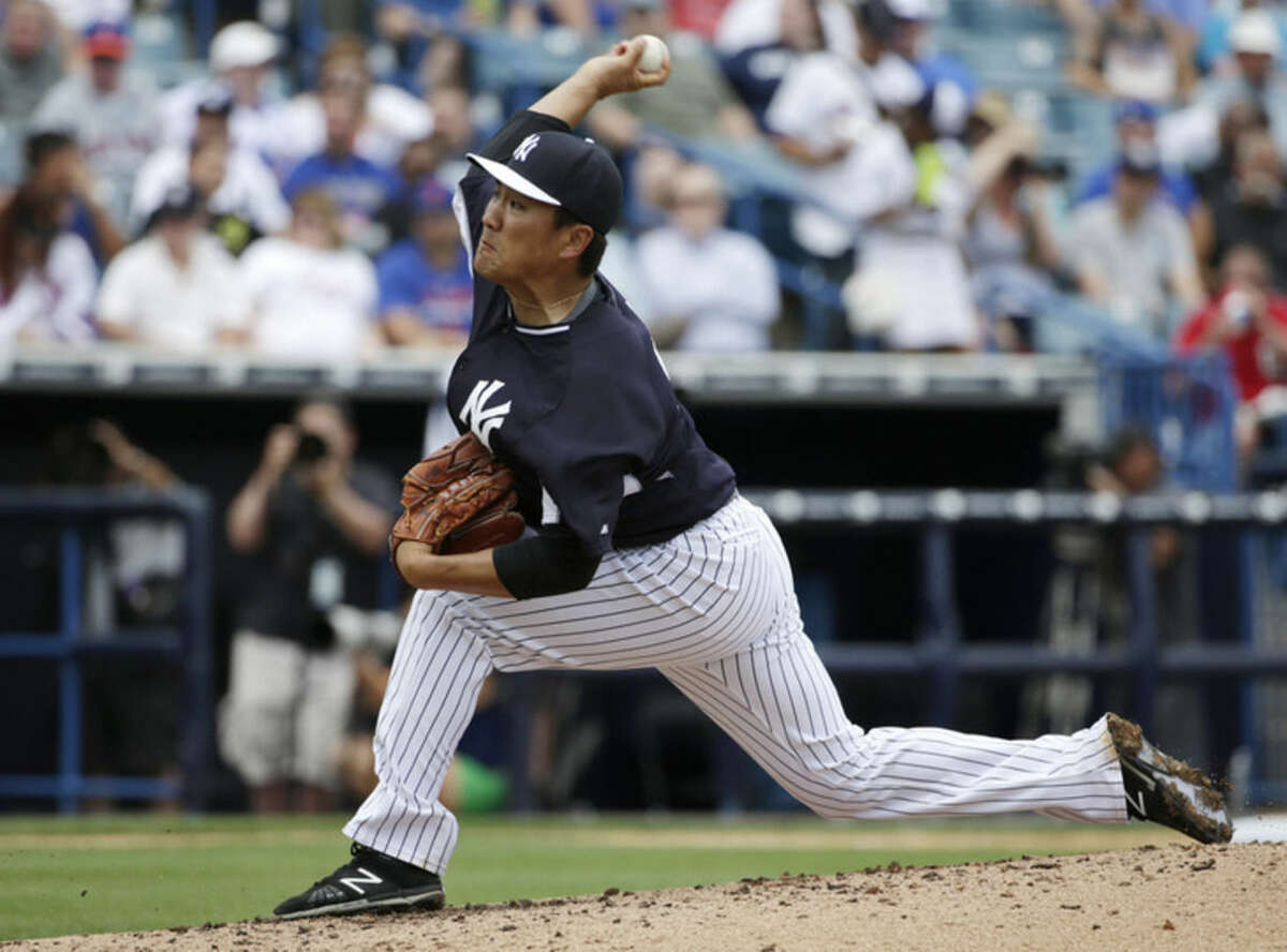 New York Yankees starting pitcher Masahiro Tanaka, of Japan, delivers in the third inning of an exhibition baseball game against the New York Mets in Tampa, Fla., Wednesday, March 25, 2015. (AP Photo/Kathy Willens)