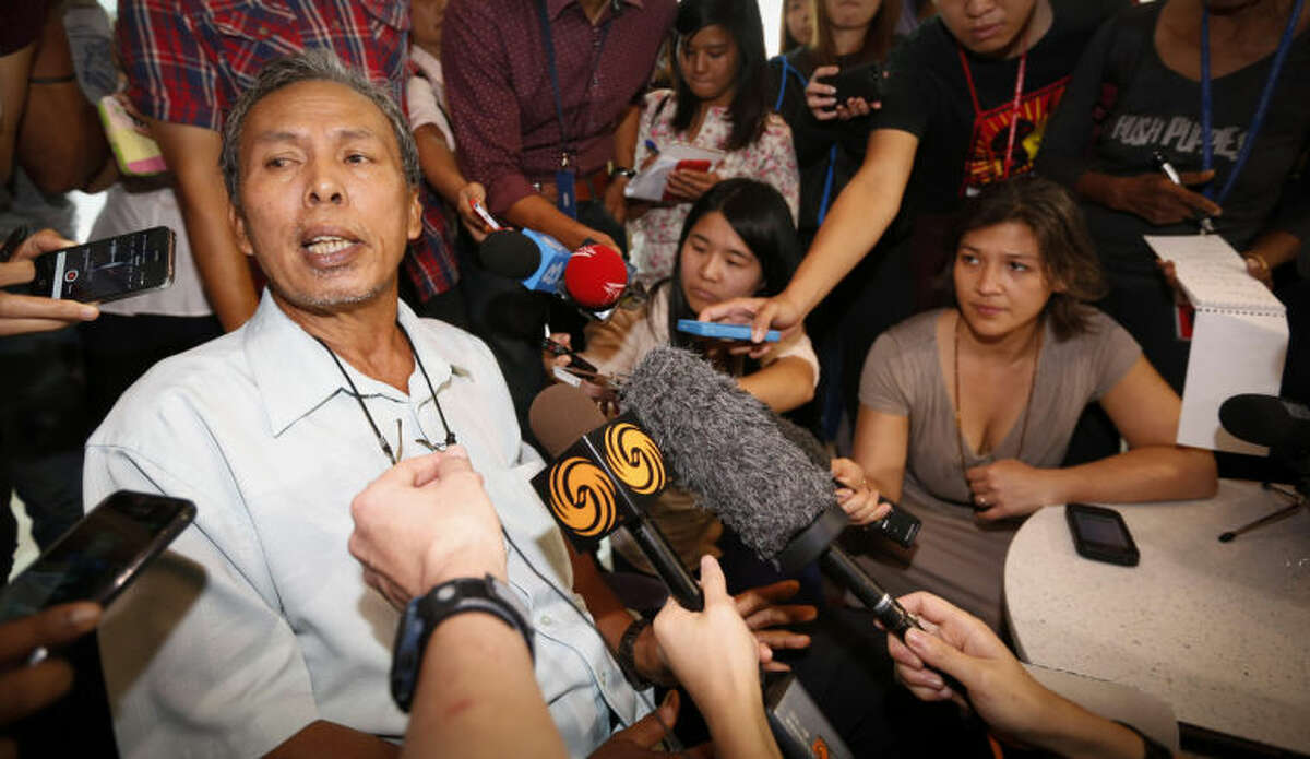 Selamat Omar, 60, father of one of the passengers aboard a missing Malaysia Airlines plane, speaks to the media at a hotel in Putrajaya, Malaysia, Thursday, March 20, 2014. Four military search planes were dispatched Thursday to try to determine whether two large objects bobbing in a remote part of the Indian Ocean were part of a possible debris field of the missing Malaysia Airlines flight. One of the objects spotted by satellite imagery had a dimension of 24 meters (almost 80 feet) and the other one was smaller. (AP Photo/Vincent Thian)
