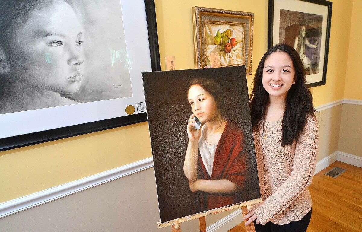 Miranda Morris with her oil on canvas painting “Renaissance Woman,” winner of the American Visions National Medal in painting.