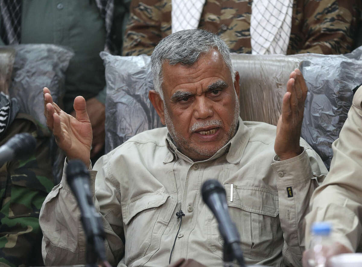 Iraqi militia leader Hadi al-Amiri speaks to the press in Samarra, Iraq 95 kilometers (60 miles) north of Baghdad, Iraq, Wednesday, March 25, 2015. Al-Amiri insisted that the Popular Mobilization Unit, which consists of various militias, does not need assistance from coalition forces to retake the militant-held city of Tikrit. The U.S. and Iraq have been discussing possible U.S. airstrikes in support of a stalled Iraqi ground offensive against a dug-in Islamic State force in Tikrit, U.S. officials said Wednesday. The prospect of U.S. airstrikes in Tikrit raises highly sensitive questions about participating in an Iraqi campaign that has been spearheaded by Iraqi Shiite militias trained and equipped by Iran, an avowed U.S. adversary. (AP Photo/Karim Kadim)
